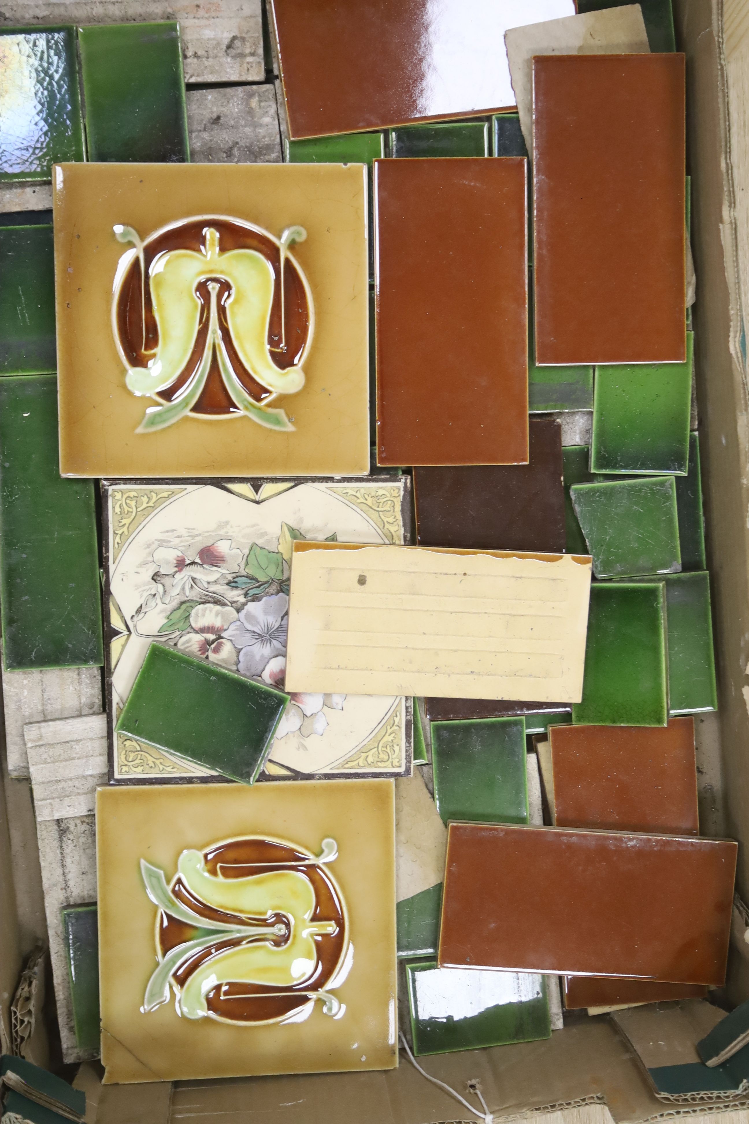 A collection of Victorian ceramic tiles and spacers